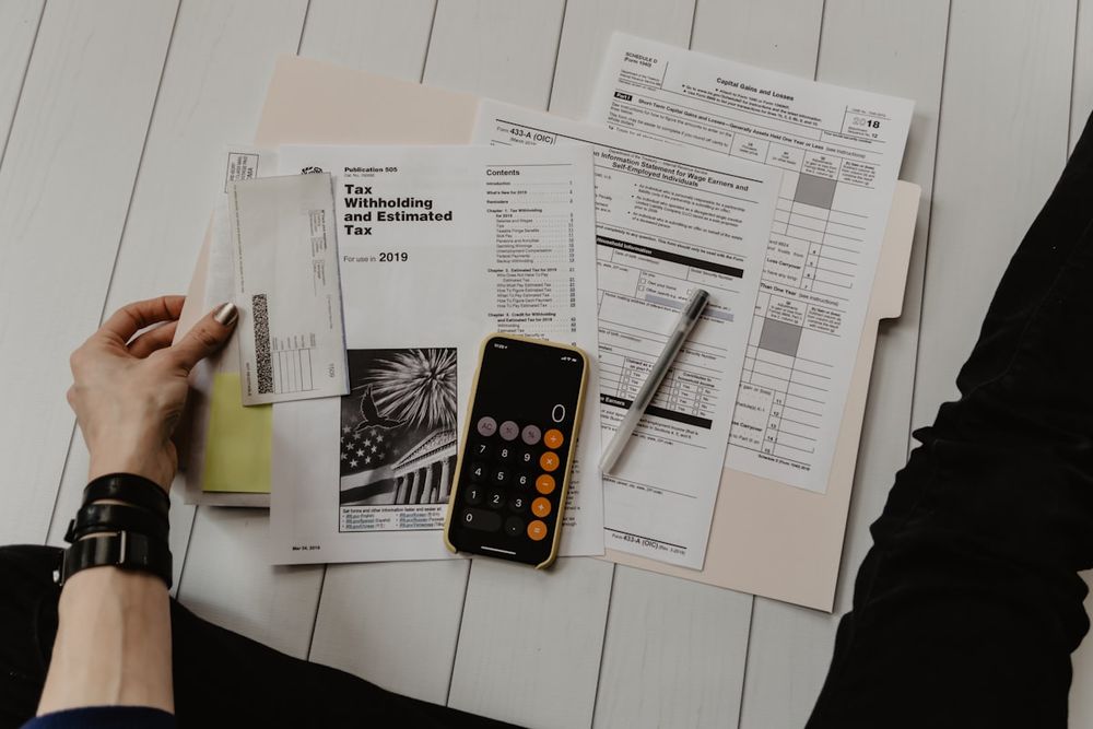 Calculator and ringgit notes — Facebook ads budget and ROI